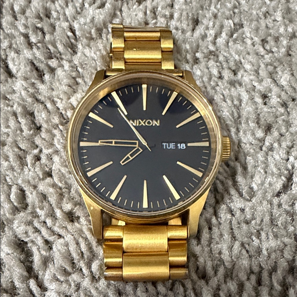 Nixon Gold-Tone Watch with Black Dial